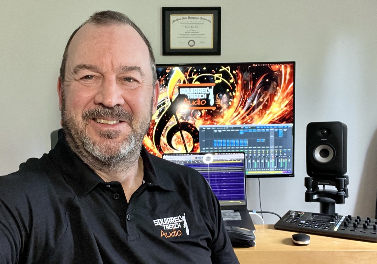 Morriss Partee at his studio desk, with a session open on screen and studio monitors beside him